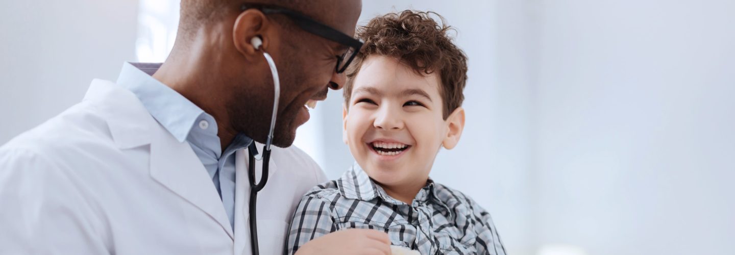 Boy smiles at doctor