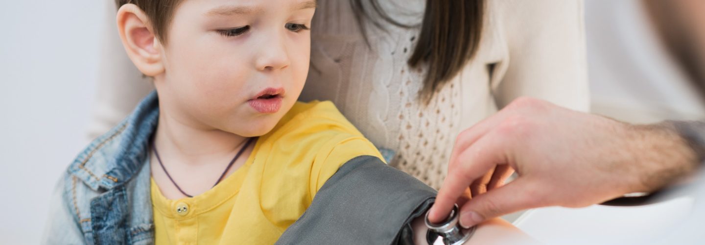 Blood pressure test on young child