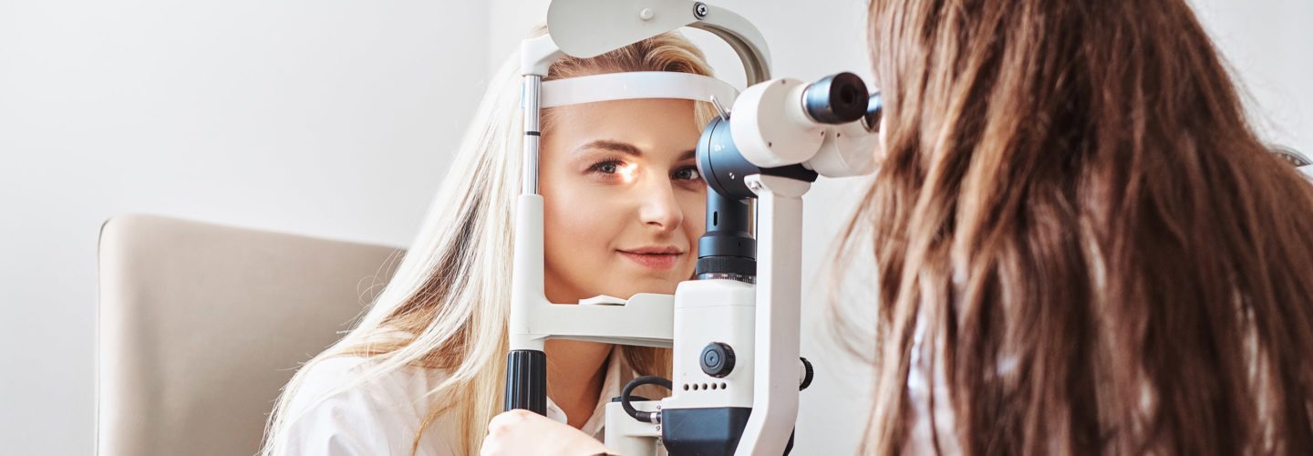 Woman receives eye exam