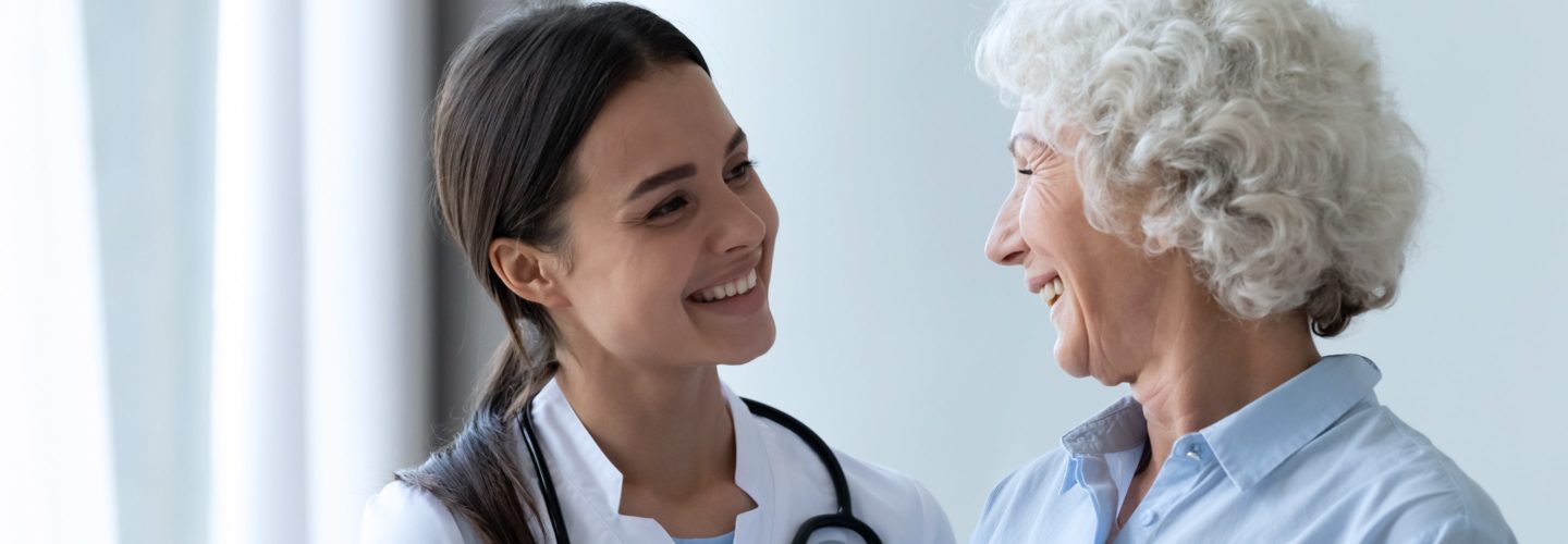 Doctor speaks with elderly patient