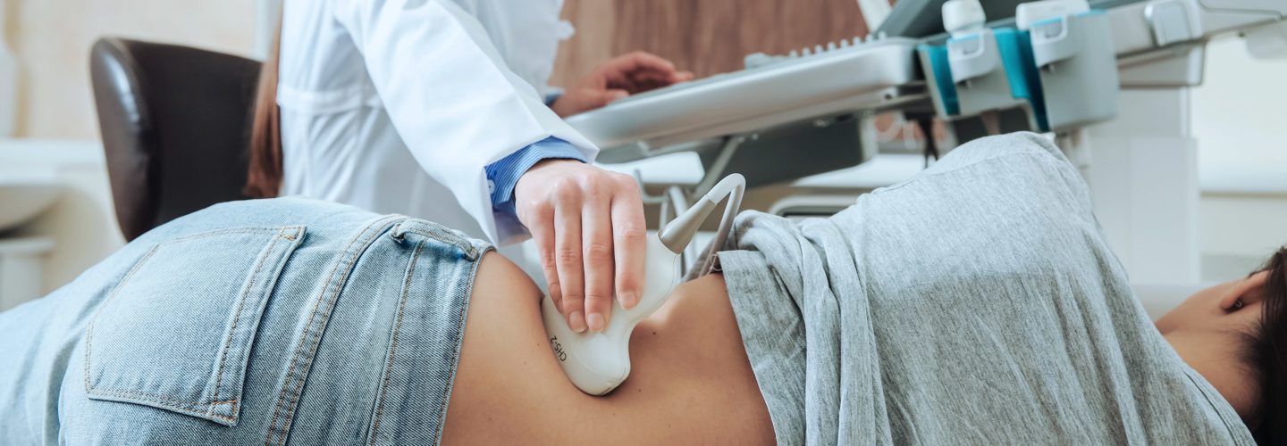 Patient receiving ultrasound on kidney