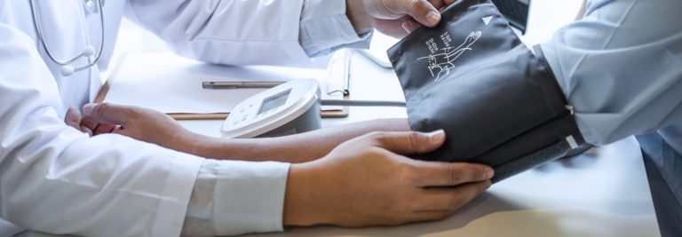 Blood pressure cuff on patient