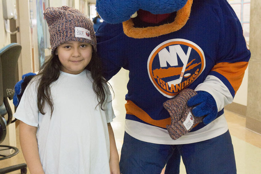 NY Islanders mascot with child