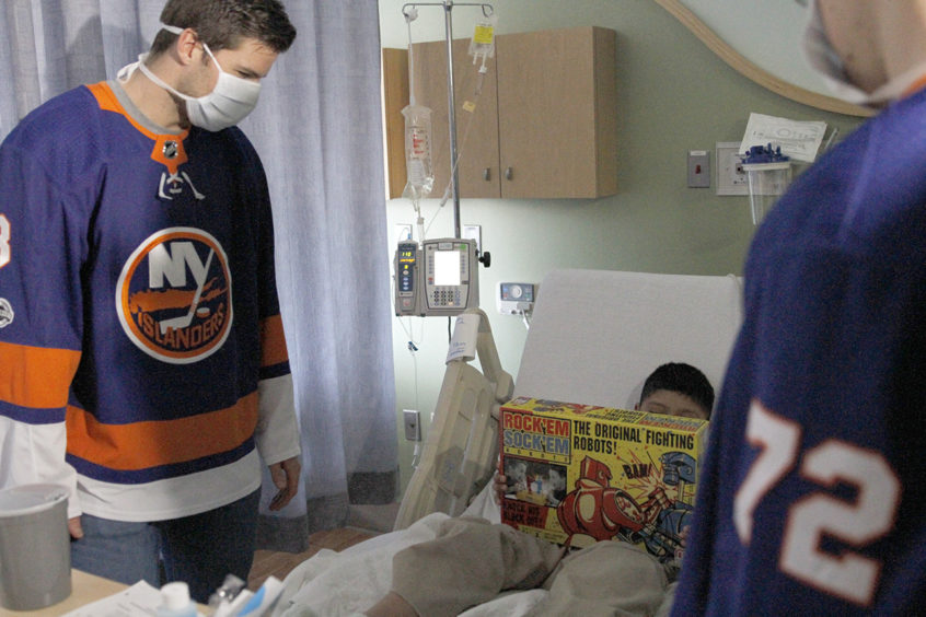 Two New York Islander players visiting patients