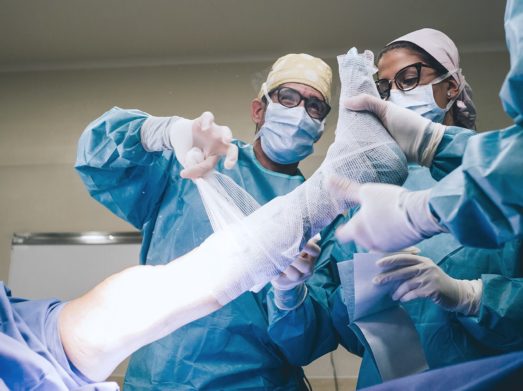 surgeon cutting bandage