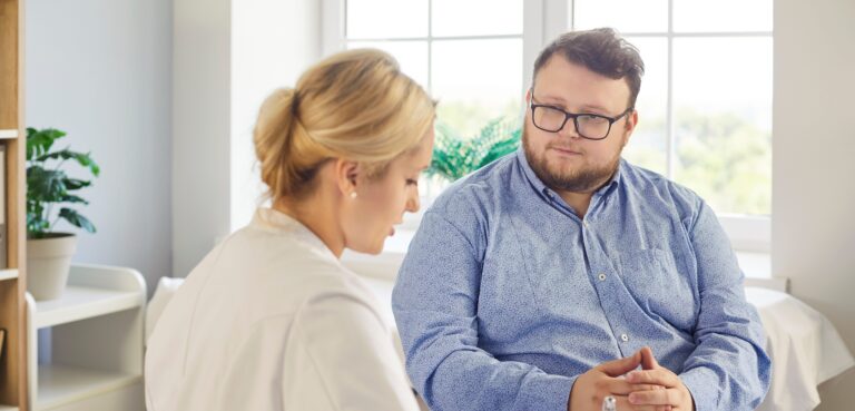 Doctor speaking with patient in medical office