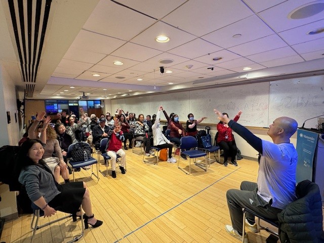 Provider leading chair exercises for a group