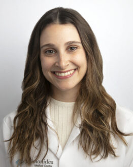 Dr. Lisa Ditcheck smiling and wearing white coat